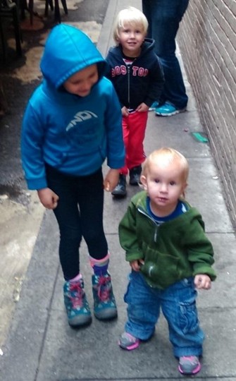 Three of the gang walking together on a San Francisco sidewalk